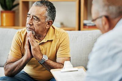 Buy stock photo Elderly man talking to a psychologist at a mental health, psychology and therapy clinic for session. Psychological therapist with clipboard for counseling checklist with senior male patient in office