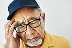 Headache, pain and face of senior man with fatigue, burnout or problem with health on white background. Stress, migraine and frustrated elderly person with hand on head in retirement with anxiety