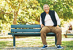 Park, happy and portrait of old man on bench outdoors for fresh air, wellness and relaxing in retirement. Smile, peace and elderly person sitting in nature for calm, freedom and and enjoy weekend