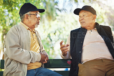 Buy stock photo Elderly men, park and communication with friendship, nature and conversation with bonding on bench. Diversity, closeup and old people with community for socialize, relaxation and discussion on life