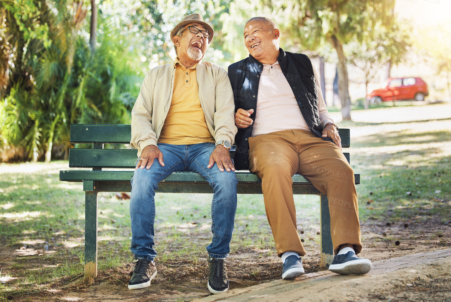 Buy stock photo Elderly friends, happy and men on park bench, talking and bonding outdoor to relax in retirement. Funny senior people sitting together in garden, communication and laughing at joke, comedy and smile