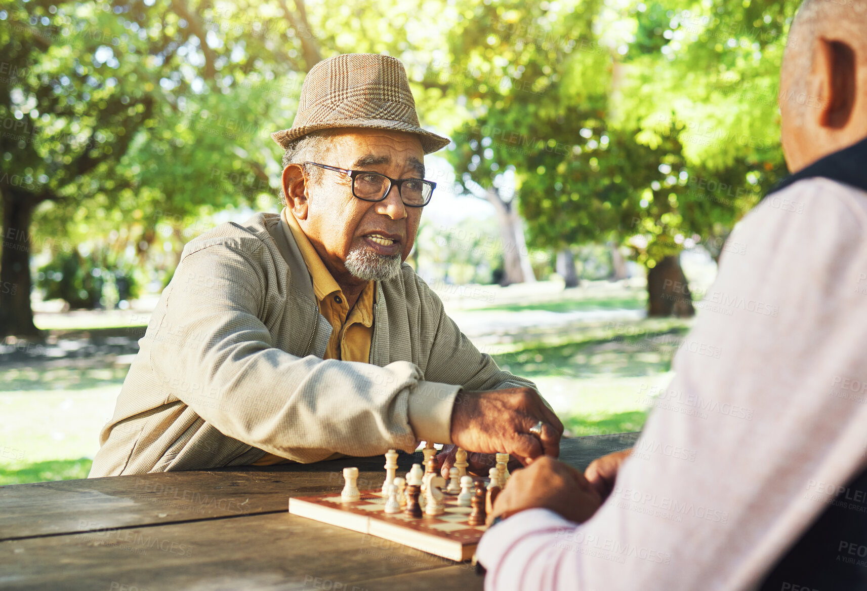 Buy stock photo Playing, outdoor and senior friends for chess, strategy and relax with a sport together. Contest, nature and elderly or old people in retirement with games in a park on a board for competition