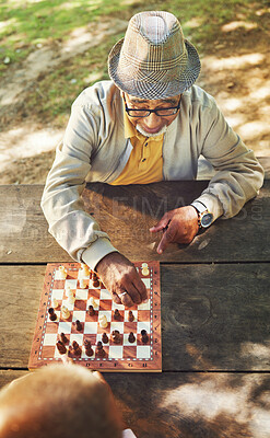 Buy stock photo Senior men, chess and game in park, above and moving with strategy, problem solving or competition. Elderly friends, retirement and playing together for contest with king, queen and knight in summer