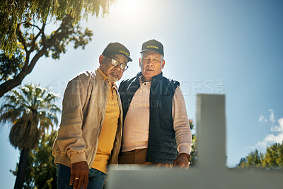 Buy stock photo Senior veteran men, tombstone and respect for military, navy or memorial in cemetery for grief, support or empathy. Elderly friends, gravestone and together with thinking, memory and love for soldier