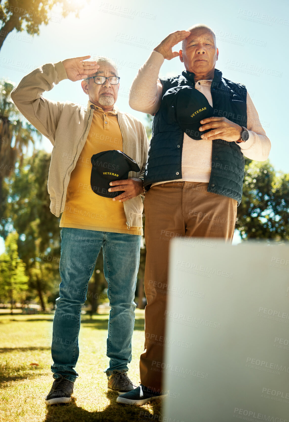 Buy stock photo Men, salute and tombstone for respect in cemetery for military, navy or memorial with grief, support or empathy. Elderly friends, gravestone and hats off with sign, memory and love for fallen soldier