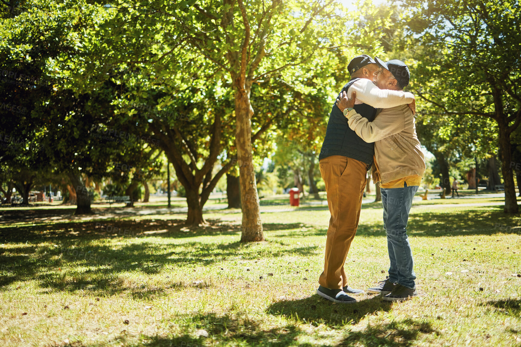 Buy stock photo Mature, men and hug on retirement in park for banner with copy space. Elderly, people or friends in nature, trees or garden for nursing home, vacation or holiday for relaxing, rehabilitation or fun