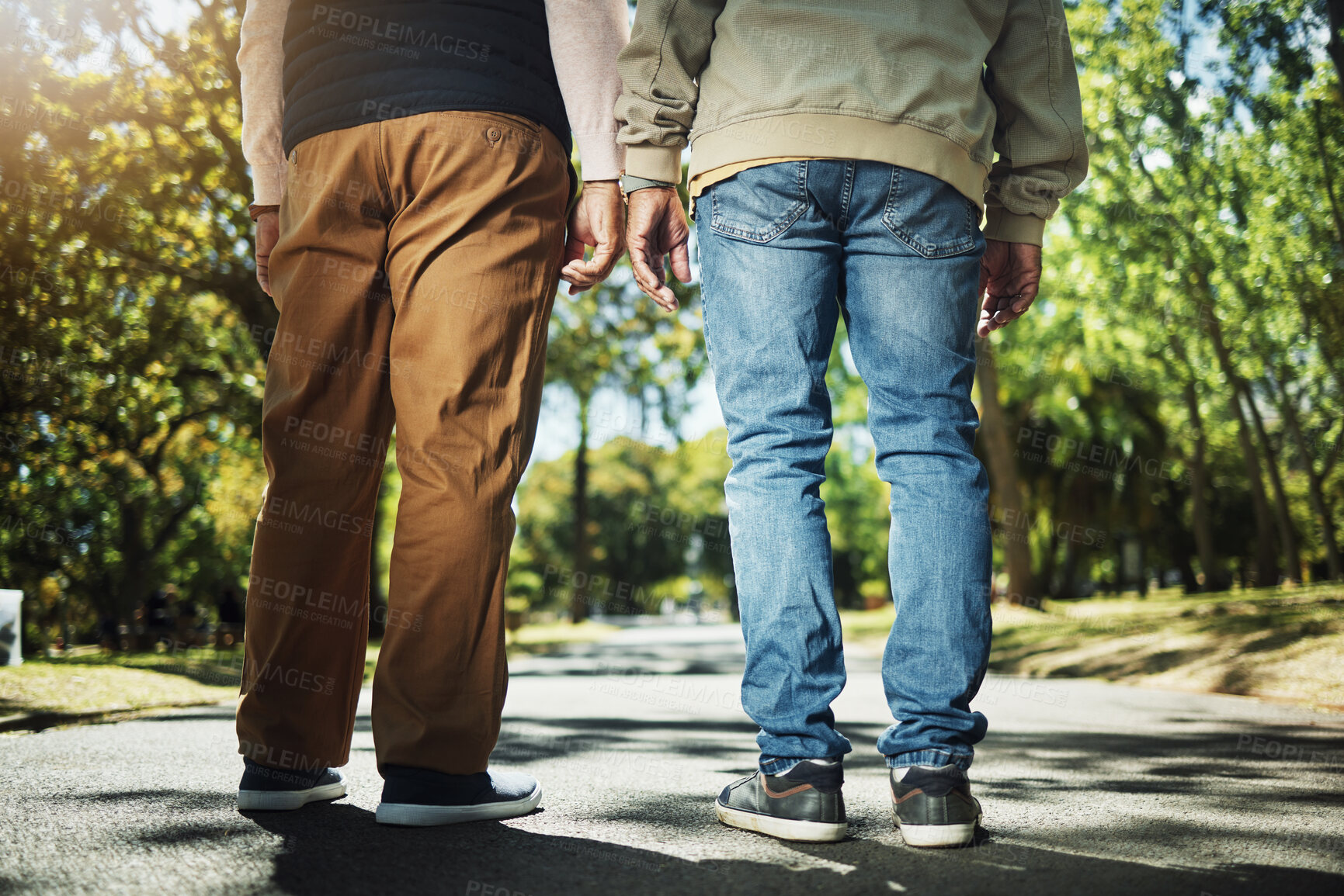 Buy stock photo Walking, park and back of men on path for wellness, fresh air and health outdoors to relax. Friends, fitness and legs of people on path in nature to relax for training, exercise and cardio workout