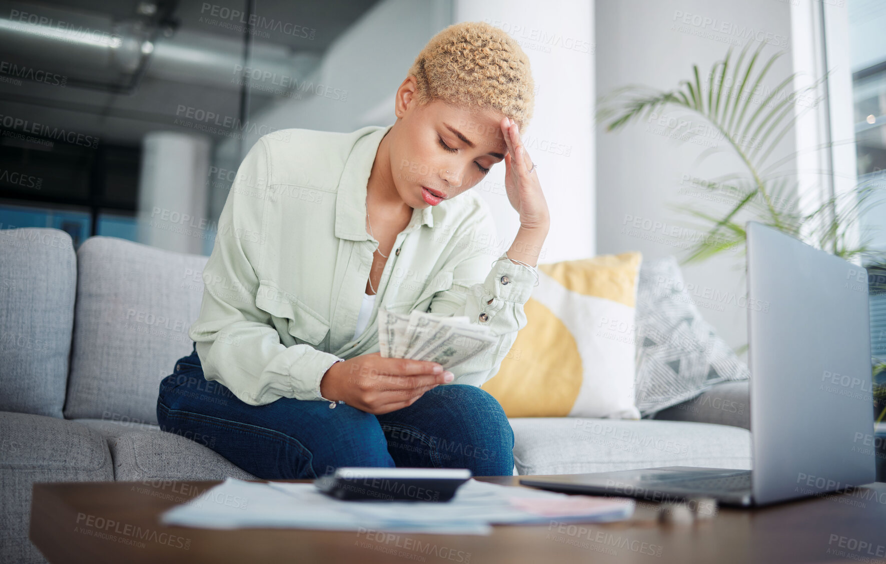 Buy stock photo Woman, headache and stress for money, home budget or income on sofa with inflation, rent or bills. African person with depression, sad or confused for laptop cash debt, loan payment or cost of living