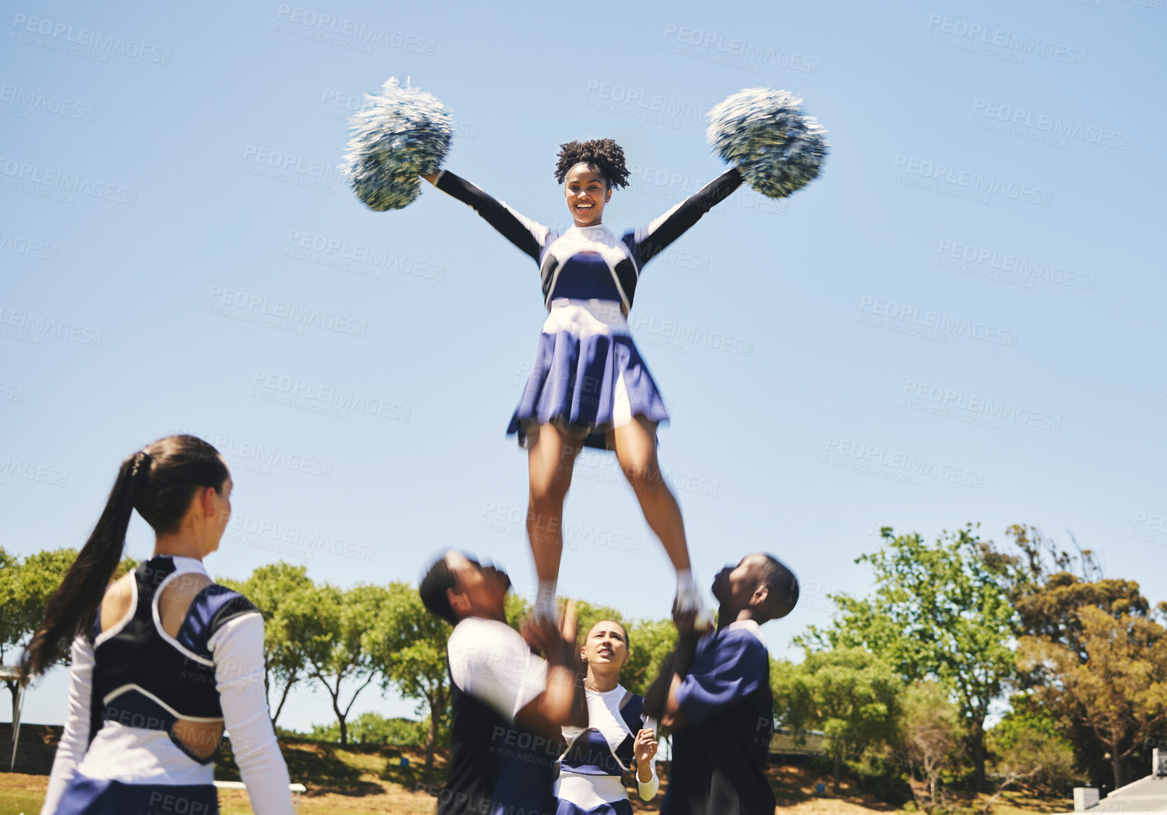 Buy stock photo Teamwork, motivation or cheerleader in air with people outdoor in training routine or sports event. Jump, sky or girl by a happy cheer squad group on a field together for support, exercise or fitness