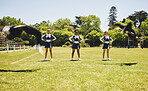Cheerleader team, practise or sports field for exercise, routine and uniform for fitness, dancers or support. Students, motion or in air for dance, wellness and train with smile, energy and formation