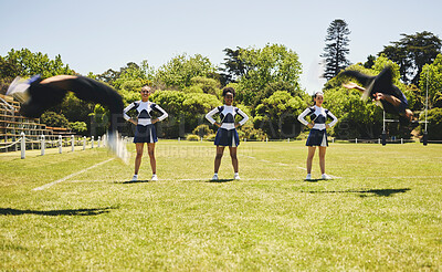 Buy stock photo Cheerleader team, practise or sports field for exercise, routine and uniform for fitness, dancers or support. Students, motion or in air for dance, wellness and train with smile, energy and formation