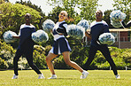 Cheerleader team, blur and portrait of people in dance performance on field outdoor for exercise, formation or training. Smile, cheerleading group and support at event, sport competition and energy