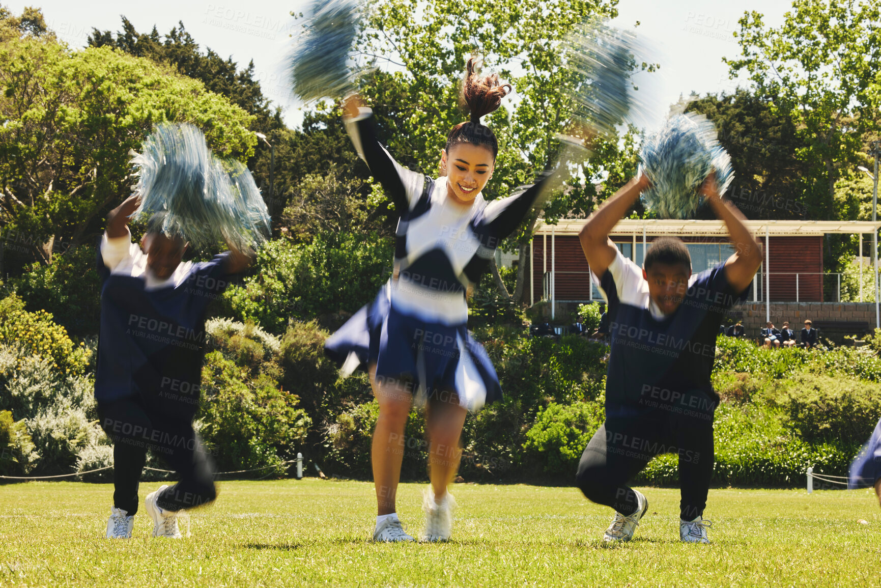 Buy stock photo Cheerleader, dancing on field and college in happiness with energy in sport, event or game. Woman, men and diversity with teamwork, training and pompoms at university, performance and competition