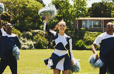 Buy stock photo Cheerleader, team and people dancing on sports field at university, uniform and props with performance. Woman, men and diversity with teamwork or training, collaboration and gymnastics with fitness