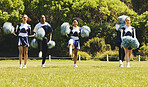 Motion blur, motivation and a cheerleader group of young people outdoor for a training routine or sports event. Smile, teamwork and diversity with a happy cheer squad on a field together for support