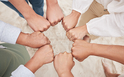 Buy stock photo Family, people and fist bump circle outdoor on beach for team building, support and unity for trust. Hands, men and women on sand in nature for community, motivation or connection with solidarity
