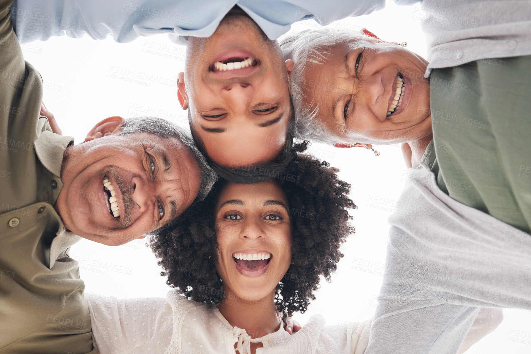 Buy stock photo Excited, portrait and a family with a huddle in nature for summer, bonding and fun together. Low, laughing and senior parents with a young man and woman with love, care and community at the beach