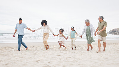 Buy stock photo Big family, walking and holding hands at a beach with support, care and trust in nature. Love, security and children with parents and grandparents at the ocean with solidarity, unity and freedom