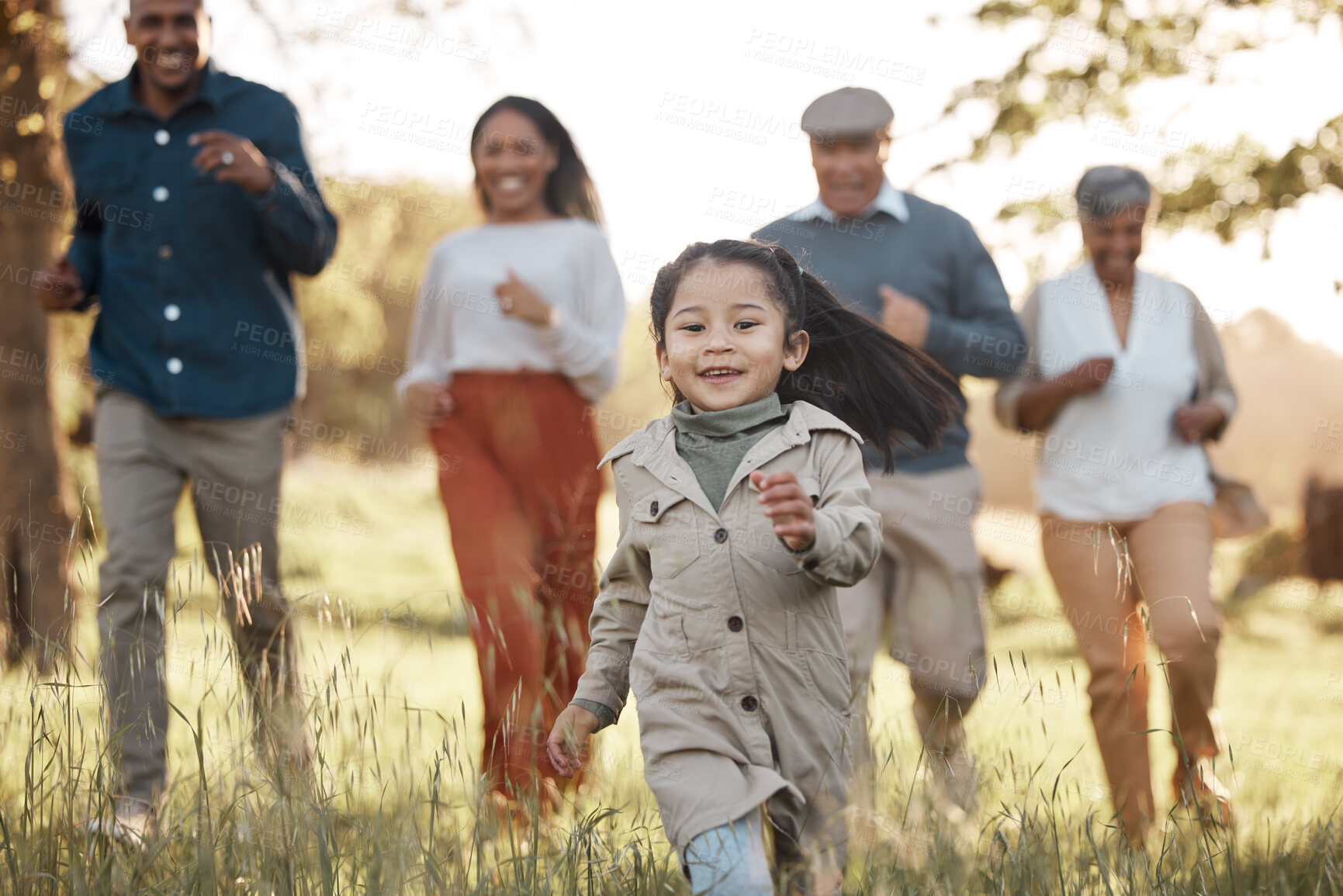 Buy stock photo Park, running and girl with parents or grandparents on grass field for freedom, adventure or playing in summer. Family, men or women with fun or love in forest with sunshine for care or happiness