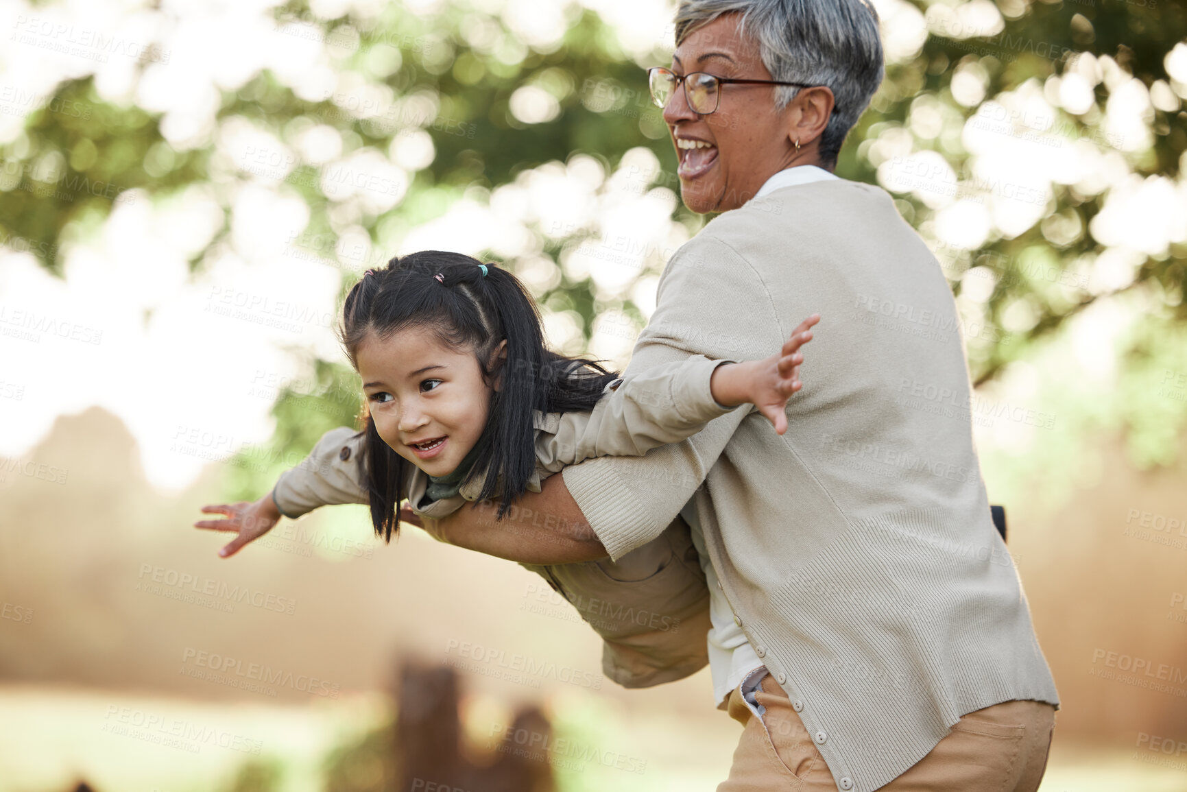 Buy stock photo Family, girl kid or grandmother with fly or airplane for fantasy play, fun game or together with bokeh in nature. People, child or grandma outdoor with happiness for love, care and bonding or excited