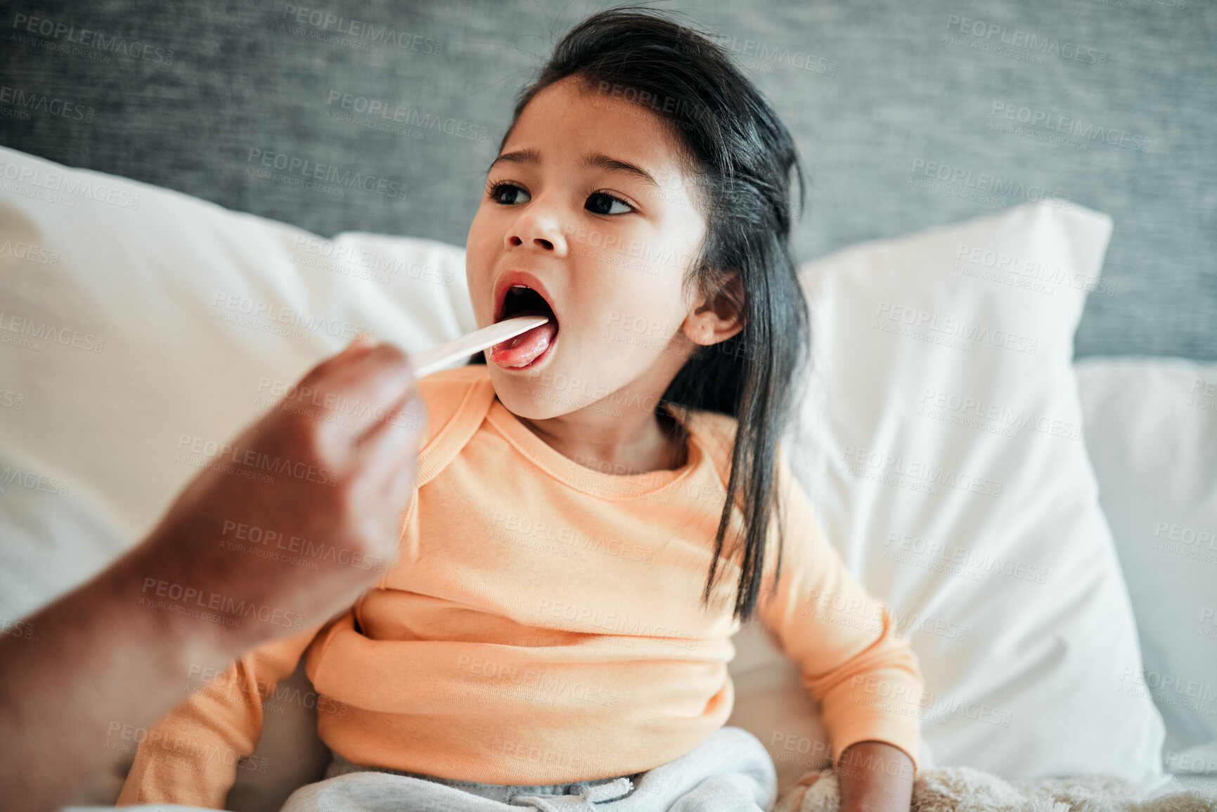 Buy stock photo Girl child, check throat and sick in bed with virus, health and wellness, parent monitor daughter at home. Inflammation, illness and young kid with the flu or cold, medical help and support in bed