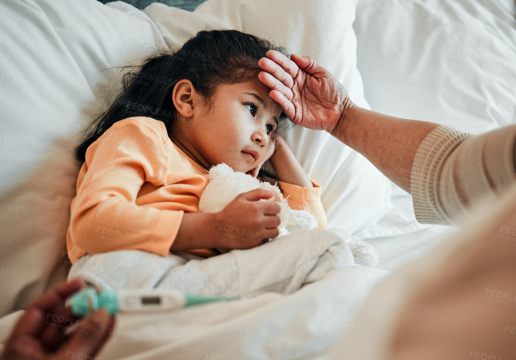 Buy stock photo Girl child, check for fever and sick in bed with thermometer, health and wellness, parent monitor temperature at home. Headache, illness and young kid with the flu, medical help and support in bed