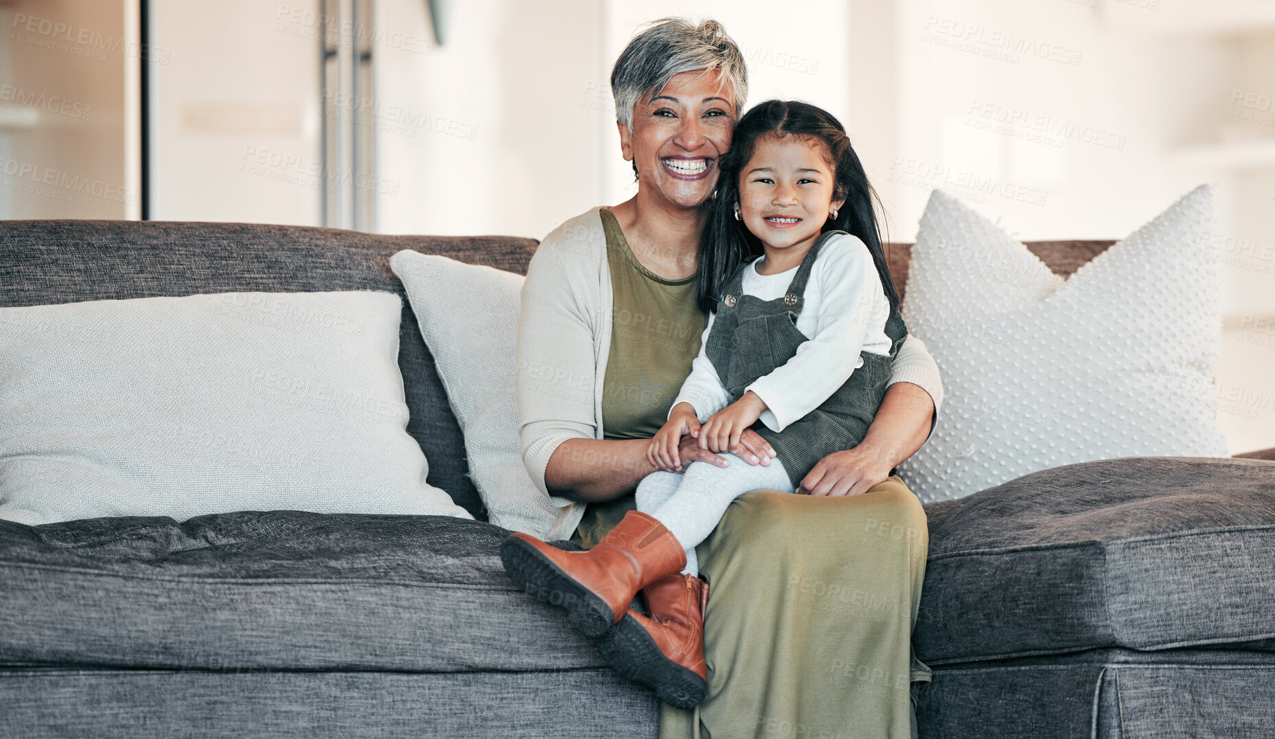 Buy stock photo Portrait, love and grandmother with child on sofa together for bonding, connection and care in living room of home. Happy family, woman and girl on couch with happiness for relaxing, weekend and face