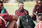 Sports, group and rugby players in a circle at training for planning strategy for game or match. Fitness, huddle and athletes talking for team building and motivation on an outdoor field for practice