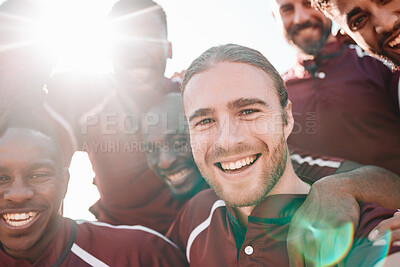 Buy stock photo Football team, portrait and happy on sports field with victory, pride and final competition. Men, diversity and sport captain in collaboration in teamwork, lens flare and champion close up in smiles