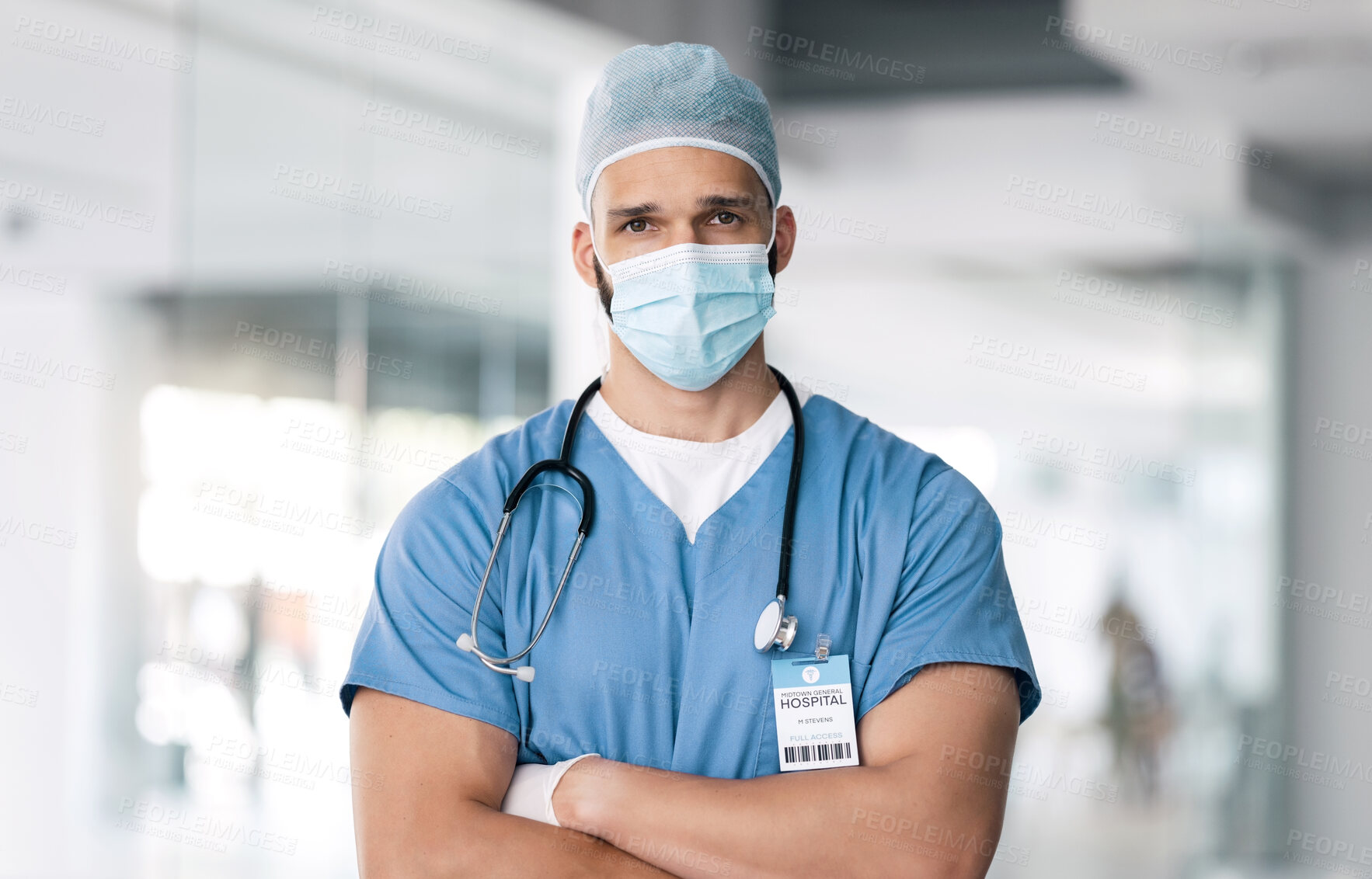 Buy stock photo Portrait of man, surgeon in hospital with mask and ppe, healthcare worker with confidence and medicine. Health expert, medical professional and face of doctor in clinic with arms crossed in safety.