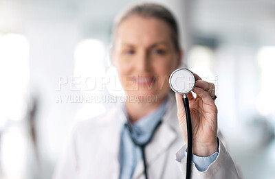 Buy stock photo Senior woman, doctor and futuristic with stethoscope, smile and appointment with bokeh background. Mature person, medical professional or happy employee with hospital equipment, worker and healthcare