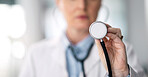 Stethoscope, hand and woman doctor closeup with healthcare, medical work and hospital job. Wellness check, heart monitoring and clinic with a female professional with working and health consulting