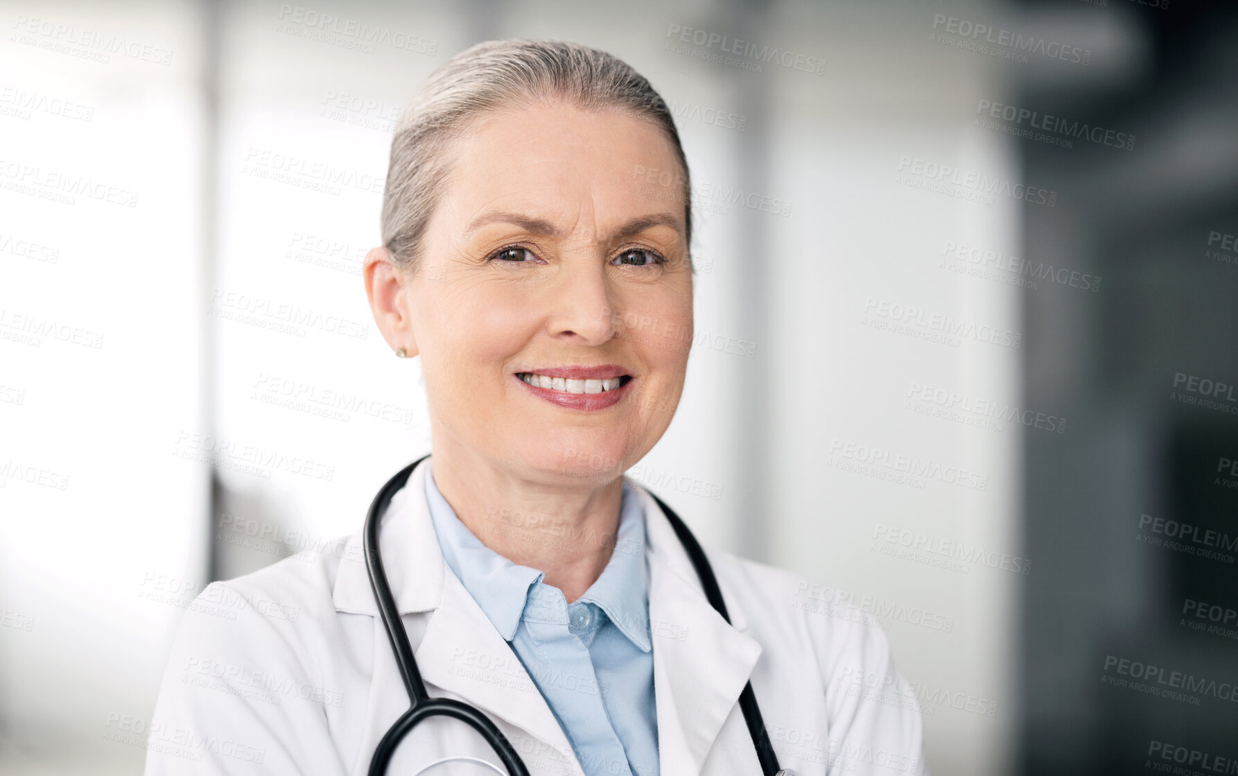 Buy stock photo Mature doctor, portrait and happy woman in hospital for healthcare, wellness or career in clinic. Face, medical professional smile and confident expert surgeon, therapist worker or employee in Canada