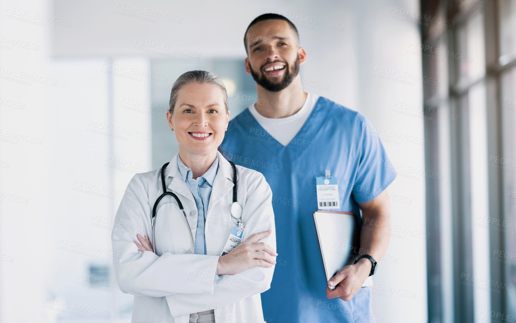 Buy stock photo Doctors, collaboration and smile in portrait for healthcare, patient results and paperwork or documents in hospital and clinic. Diversity in team, health and medical by mature woman with arms crossed