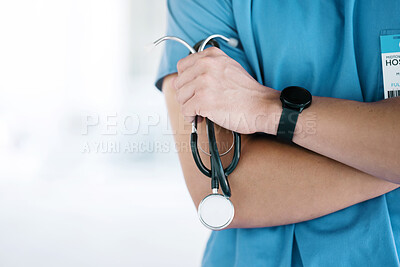 Buy stock photo Closeup, hands of surgeon and arms crossed with stethoscope in hospital, surgery or clinic mockup. Cardiology doctor with medical tools of consulting, healthcare services or cardiovascular evaluation