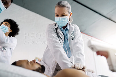 Buy stock photo CPR, emergency and doctor with patient for medical service, first aid and surgery in hospital. Healthcare, teamwork and woman do chest compression for injury, serious accident and wellness in clinic
