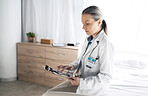 Healthcare, woman and doctor with tablet on bed for communication, checklist and telehealth at hospital. Professional, employee and person with touchscreen for online consultation and support on web