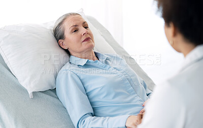 Hospital, doctor and mature patient with care, comfort and empathy for diagnosis news in bed. Healthcare, clinic and health worker with woman holding hands for support, wellness and medical results