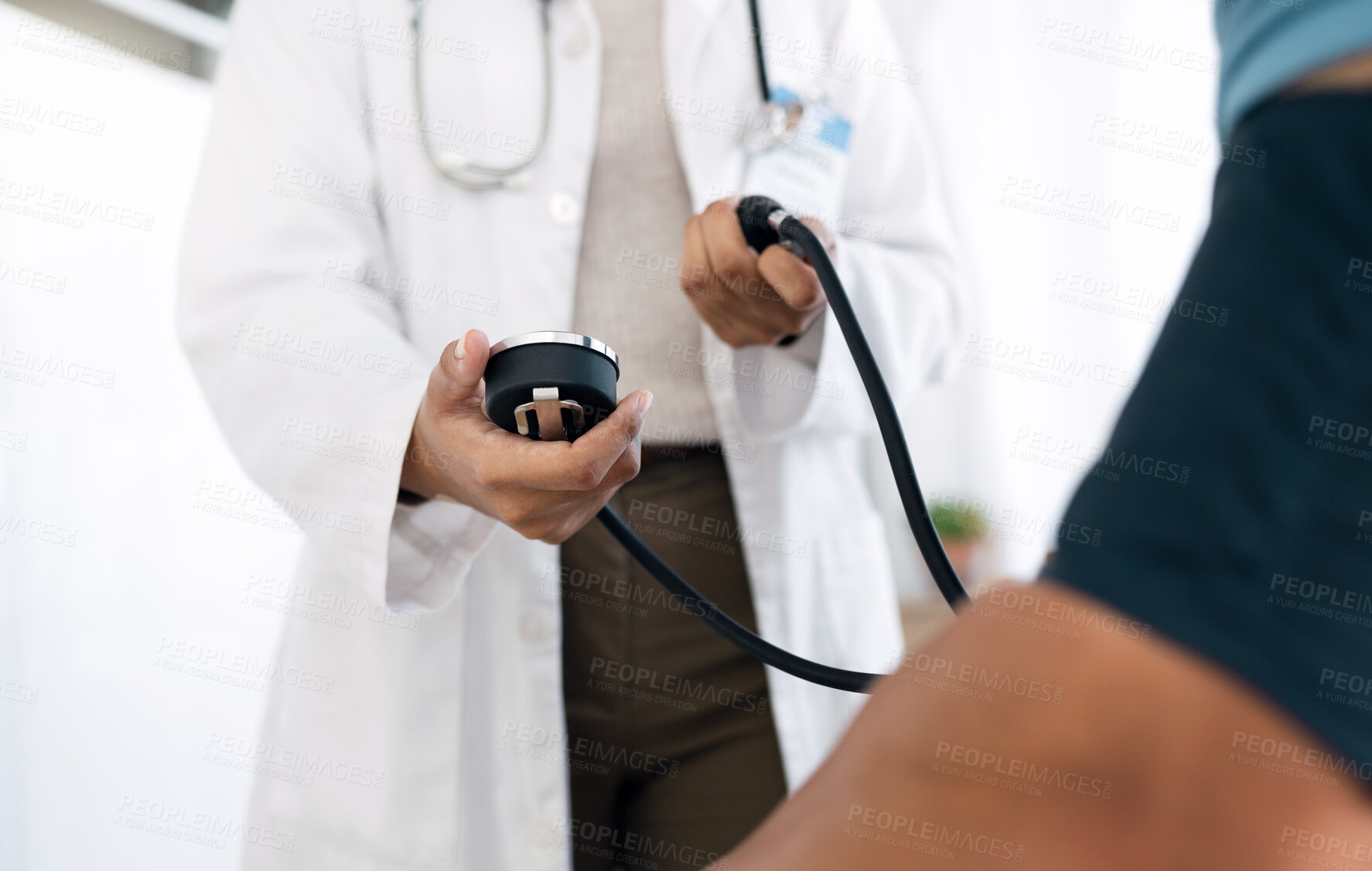 Buy stock photo Clinic hands, people and doctor hypertension test for medical exam, assessment or health consultation. Closeup surgeon, professional nurse or monitor blood pressure, pulse or reading sphygmomanometer
