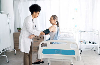 Buy stock photo Clinic patient, happy people and doctor hypertension test for medical exam, assessment or professional service. Medicine expert, sphygmomanometer and nurse monitor blood pressure, pulse or wellness