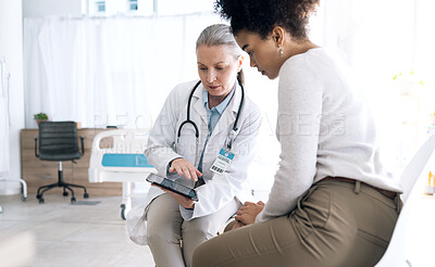 Buy stock photo Doctor, women and tablet in medical consultation, hospital meeting and talking of online results, test or feedback. Medical professional and patient reading of digital information or advice in clinic