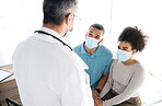 Hospital conversation, couple and doctor consulting on medical consultation, gynecology news or wellness health support. Gynecologist discussion, face mask and marriage people listening to feedback