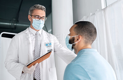 Buy stock photo Hospital men, clipboard and doctor consulting on medical results, assessment or wellness health report, support or help. Consultation exam, services and clinic expert, surgeon or nurse feedback notes