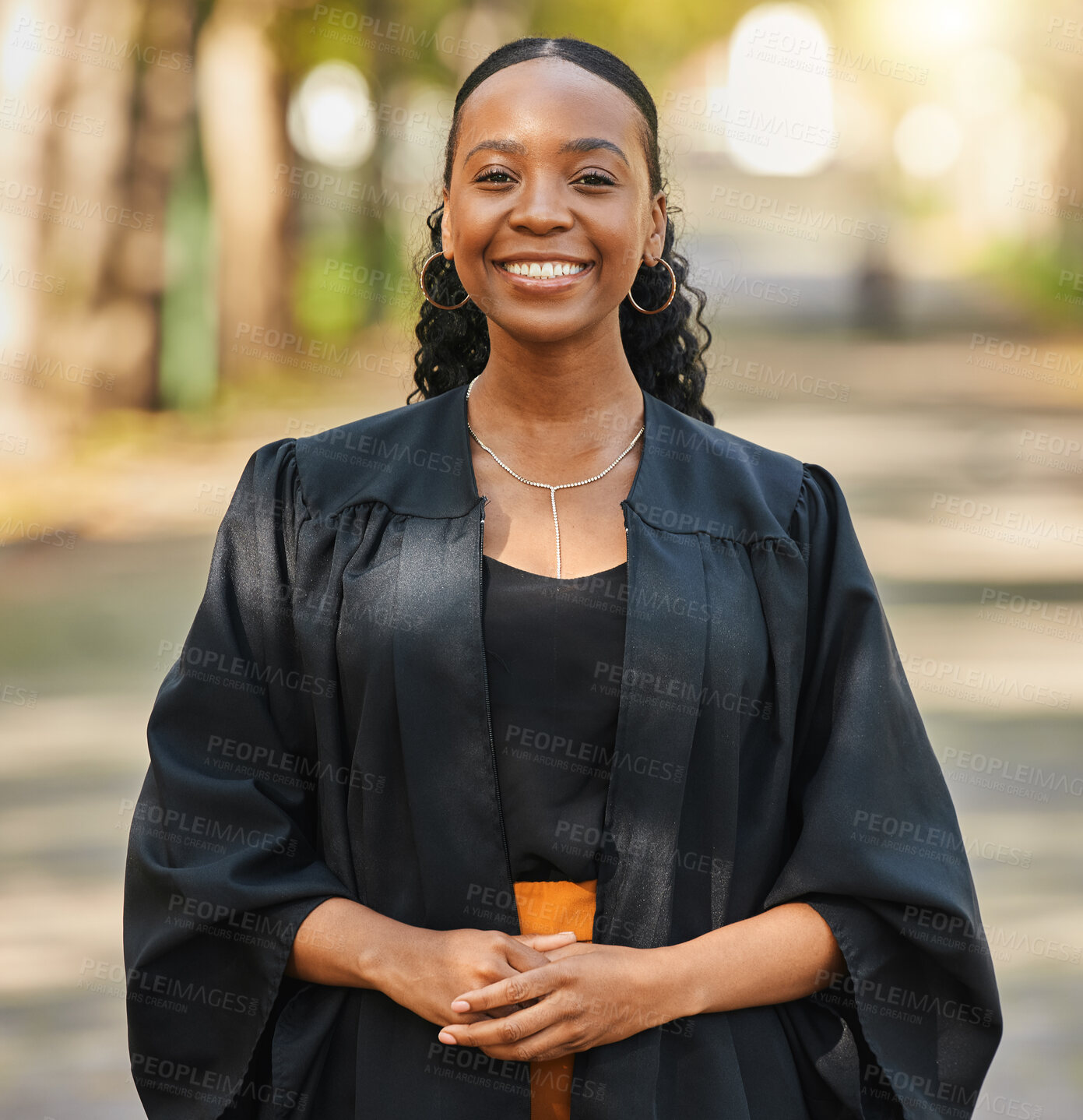 Buy stock photo Portrait, graduate and happy black woman at university at campus outdoor. Face, graduation and smile of confident African student at college for education achievement, learning and success in Nigeria