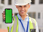 Engineering man, phone green screen and outdoor for contact information of architecture, renovation or design. Portrait, construction worker or builder and mobile app mockup or industrial advertising