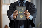 Hands, judge and law book for justice, knowledge and study constitution for decision in court. Legal expert, attorney or advocate and choice for equality, consultation and compliance for government