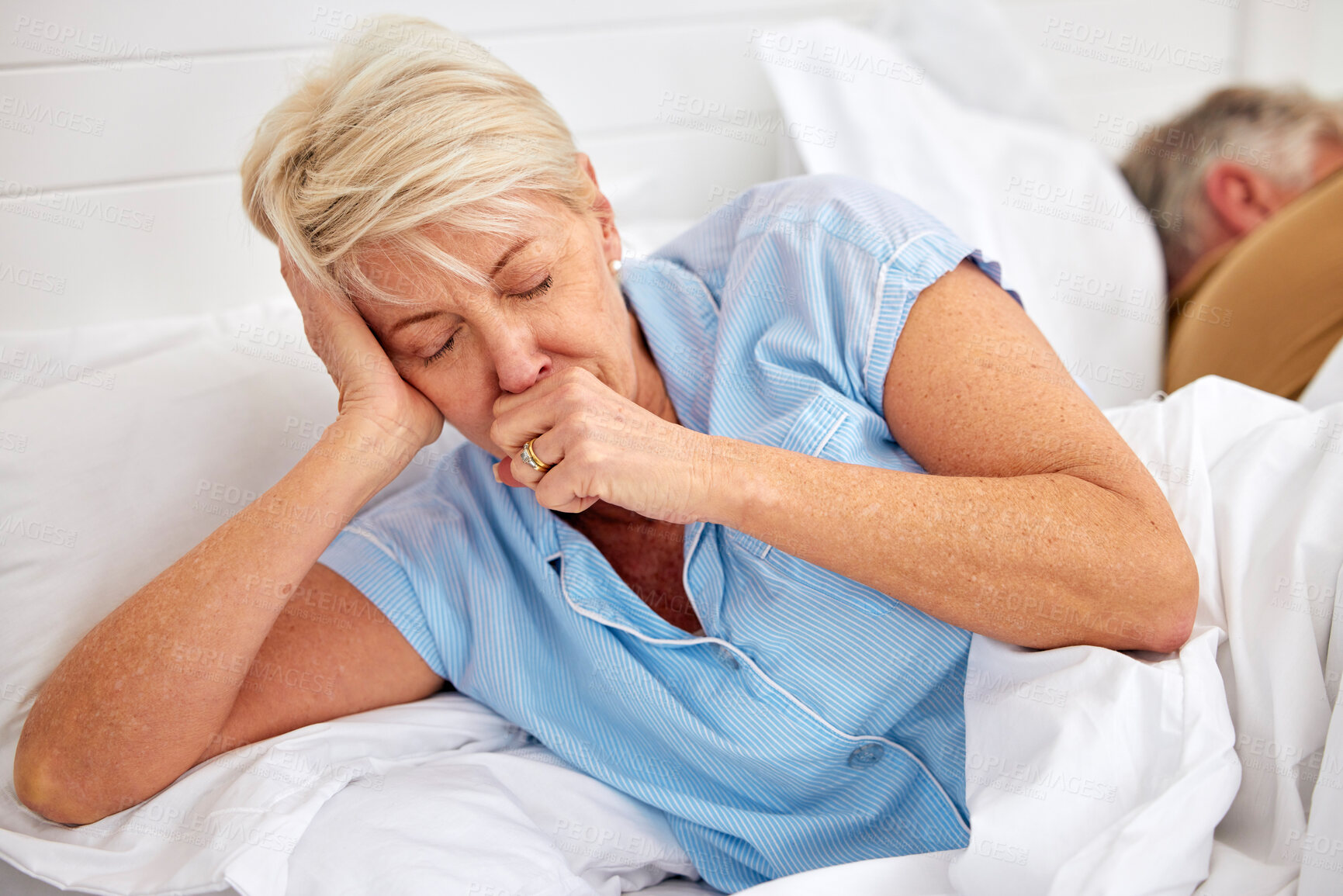 Buy stock photo Couple, coughing or sick old woman in bed with husband or man with flu virus, tuberculosis or health problem. Chest pain, mature lady or senior person with cold, fever or lung illness in home bedroom