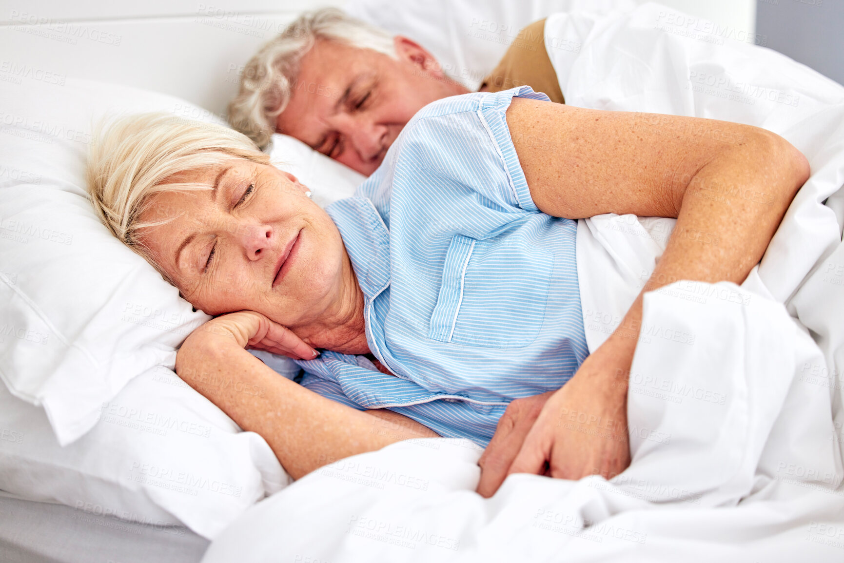 Buy stock photo Sleeping, bedroom and senior couple with love, relax and retirement on a weekend break, resting and calm. Peace, old woman or elderly man in a bed, home or morning with care, marriage or relationship