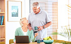 Ecommerce, senior or happy couple with laptop, credit card or discount code for digital product at home. Coffee, online shopping promo or mature people on fintech website for payment to buy on sale