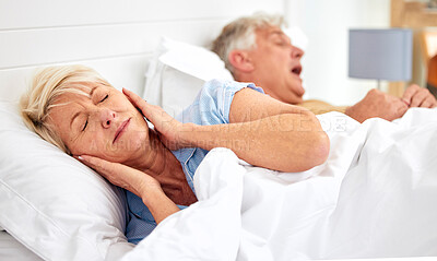 Buy stock photo Snoring, problem and woman with frustrated with noise, sound or husband sleeping in bed with wife. Elderly, couple and man snore in sleep in retirement home bedroom and lady with hands on ears